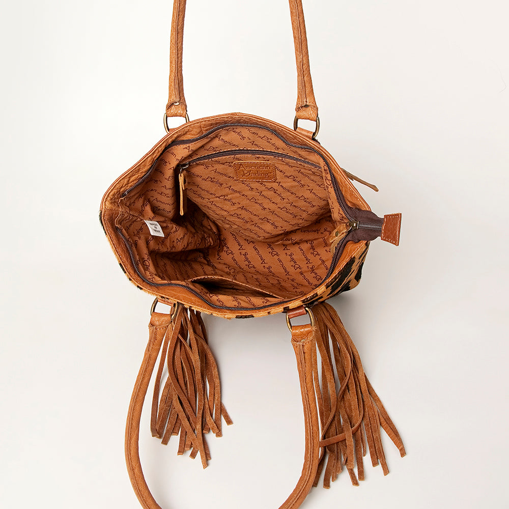 LC-ADBGA208 Hair-On Cowhide Tote with Tooled Leather Medallion, Fringe & Turquoise Accent
