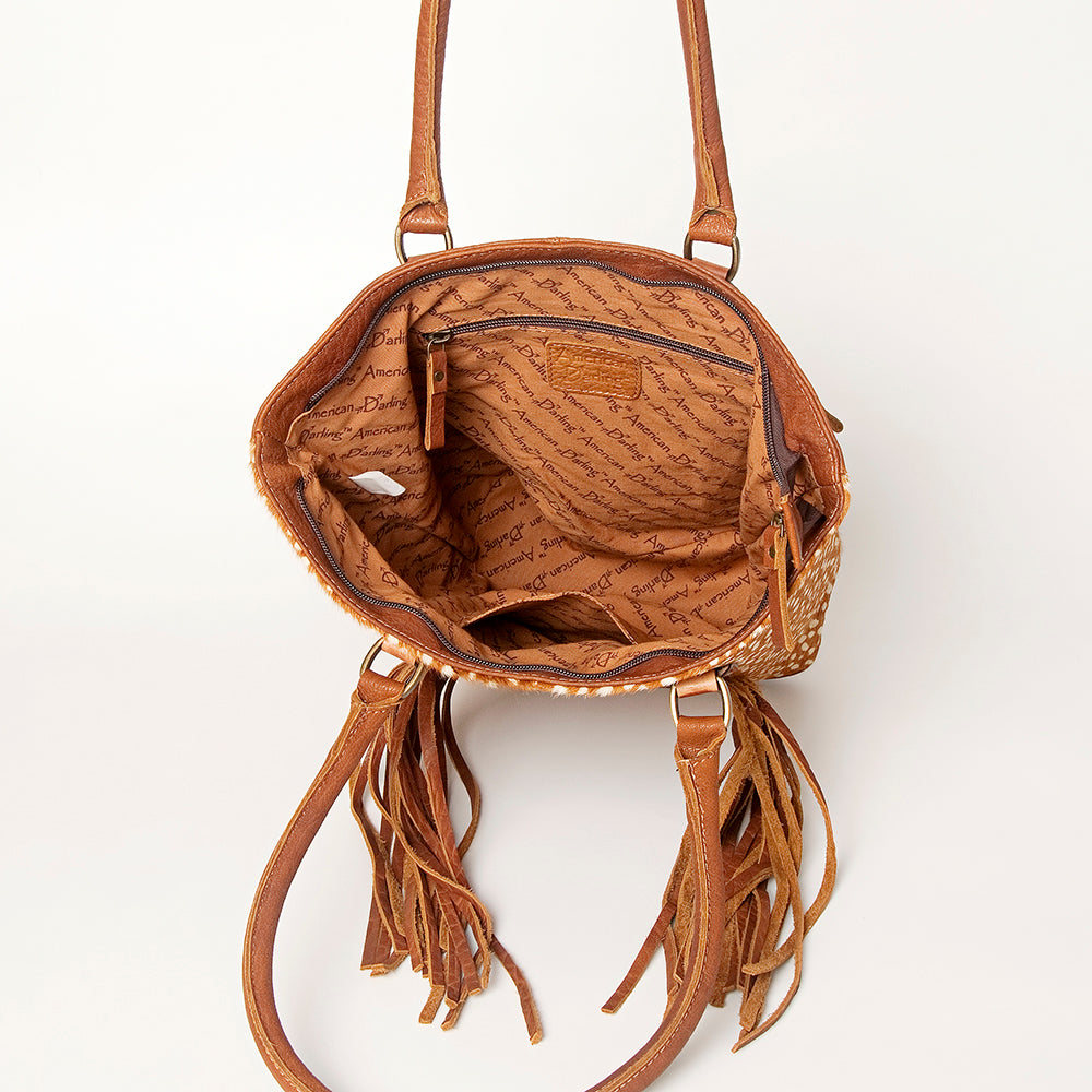 LC-ADBGA208 Hair-On Cowhide Tote with Tooled Leather Medallion, Fringe & Turquoise Accent