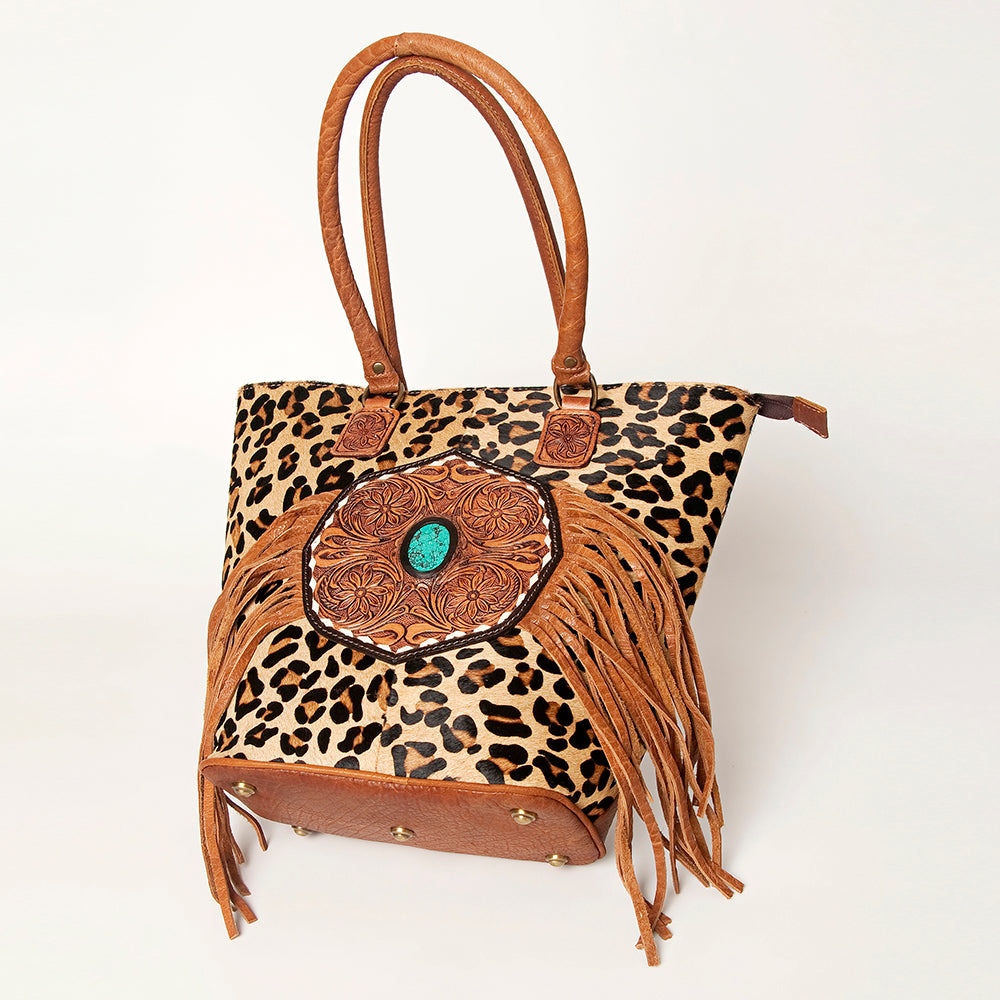 LC-ADBGA208 Hair-On Cowhide Tote with Tooled Leather Medallion, Fringe & Turquoise Accent