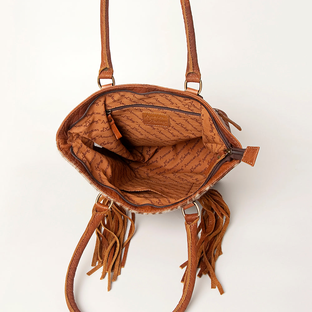 LC-ADBGA208 Hair-On Cowhide Tote with Tooled Leather Medallion, Fringe & Turquoise Accent