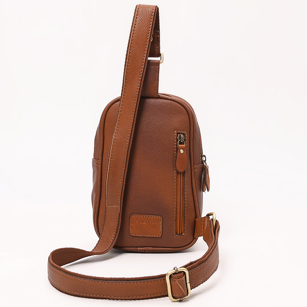 ADBGA654 Tooled Leather & Cowhide Sling Bag with Floral Front Pocket and Whipstitch Trim