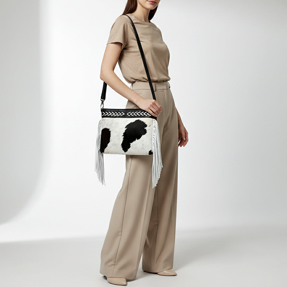 ADBG1628 Black & White Cowhide Leather Crossbody Bag with White Fringe and Arrow Stitch Detail