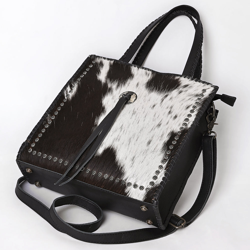 ADBG1751 Black & White Cowhide Leather Tote Bag with Silver Stud Accents and Concho Tassel
