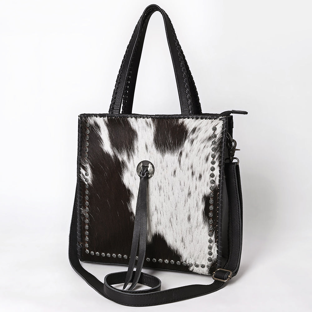 ADBG1751 Black & White Cowhide Leather Tote Bag with Silver Stud Accents and Concho Tassel