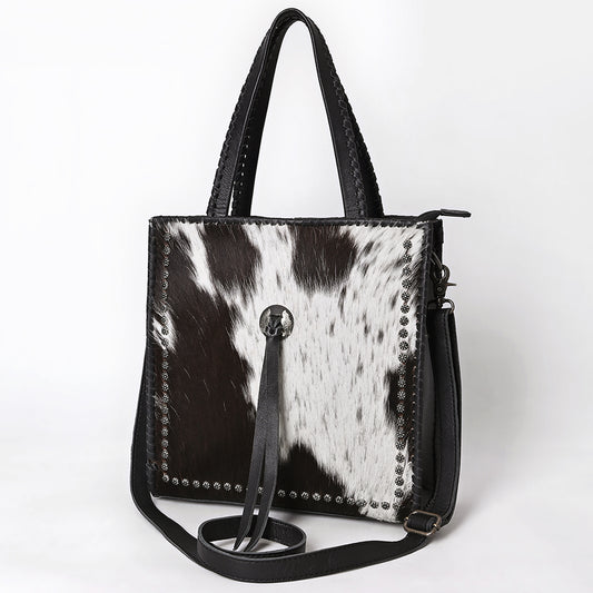 ADBG1751 Black & White Cowhide Leather Tote Bag with Silver Stud Accents and Concho Tassel